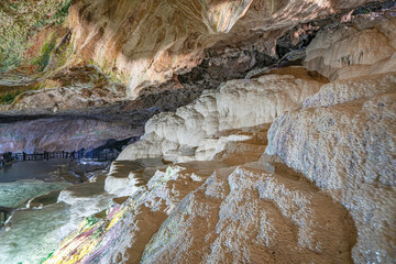 The scenic views of Kaklık cave which is full of dripstones, stalactites and stalagmites. There are also travertine formations and a small thermal lake at the bottom of the cave in Denizli, Turkey
