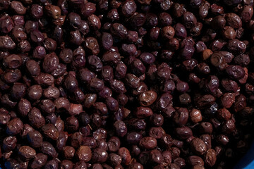 Background of black olives close up
