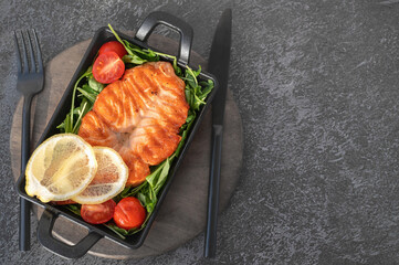 Grilled salmon butterfly steak with vegetables and sea salt. The concept of a healthy balanced diet. Copy space