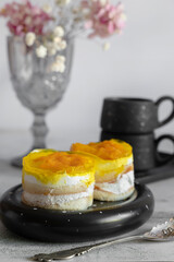 dessert made from yogurt and jelly. Orange peach and sponge cake layered dessert idea, yogurt and fruit layered dessert idea. Soft selective focus