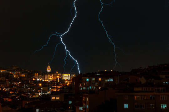 A powerful electric shock hits the city center with multiple lightning strikes near the Istanbul Galata tower..