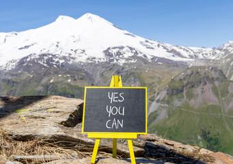 Motivational and Yes you can symbol. Concept words Yes you can on beautiful black chalk blackboard....