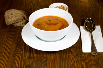 Cream soup puree with mushroom on wooden background