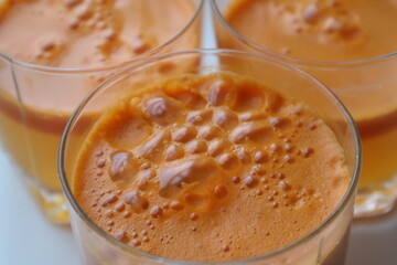 glass of fresh carrot and pumpkin juice