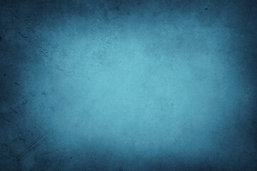 Blue textured concrete wall background. Dark edges