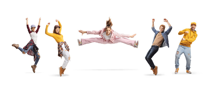 Girl leaping in the air and making a split and people dancing around