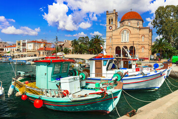 Saronics islands of Greece . charming beautiful Greek island -Aegina with traditional fishing boats and St. Nicholas Church. - 746725594