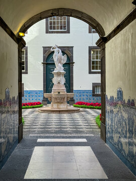 Courtyard view with majestic sculpture in city hall Pa&ccedil;os do Concelho in city centre of Funchal, Madeira island, Portugal, Europe. Marble statue of Leda and the Swan. Tourist destination.