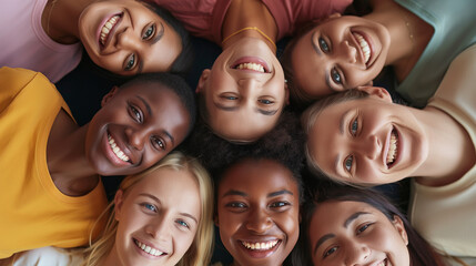 Diverse Group of Friends Smiling Together. A vibrant circle of multiethnic friends lying down, heads together, with genuine smiles and a sense of unity and friendship.