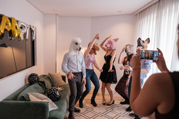 Group of friends at an animal mask party. Concept: fun, enjoy, happiness
