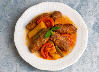 Traditional Homemade Turkish Food Kofte - Kofta with Tomato Sauce and Potatoes. (Turkish name; Izmir kofte)