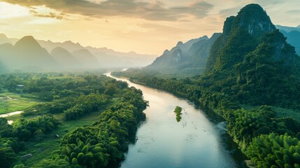 Beautiful natural scenery of river in southeast Asia tropical green forest with mountains in background, aerial view drone shot - obrazy, fototapety, plakaty