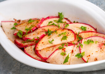 Turkish appetizers; sliced radish appetizer with sour, Turkish name; Turp mezesi