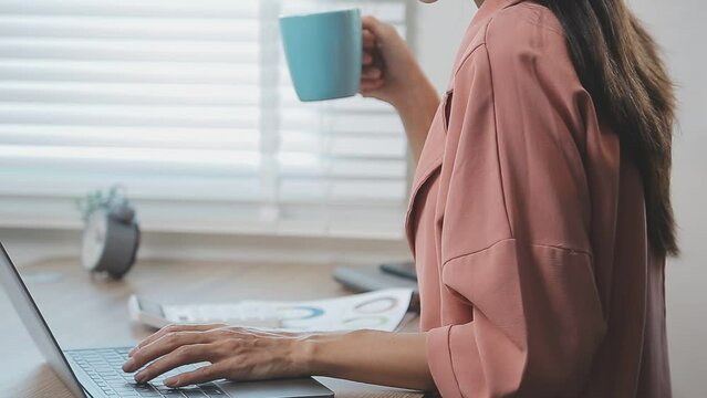 Charming woman with beautiful smile reading good news on mobile phone during rest in coffee shop, happy Caucasian female watching her photos on cell telephone while relaxing in cafe during free time