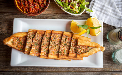 Turkish pide with minced meat, Turkish name; Kiymali Pide. Traditional Turkish cuisine. Turkish pizza Pita with meat.