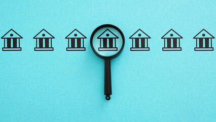 Bank research. Magnifying glass and the bank. Interest rates, investment opportunities, and...