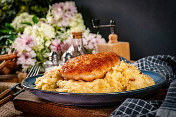 Minced meat cutlet with boiled sauerkraut.