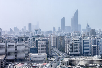 Aerial view on hazy Abu Dhabi cityscape at afternoon time