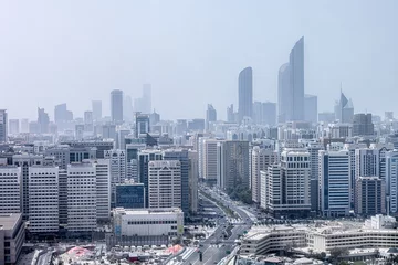 Zelfklevend Fotobehang Aerial view on hazy Abu Dhabi cityscape at afternoon time © Freelancer