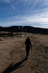 woman walking up the mountain