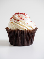 close up of delicious sweet cupcake on white background