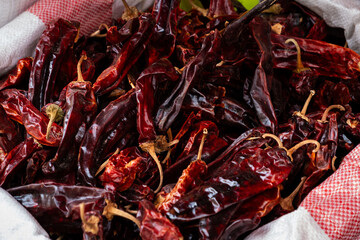 Dried red chili peppers in a sack at Levinski Market, Tel Aviv, vibrant and spicy