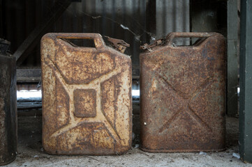 Detail of a pair of rusty jerrycan petrol cans from the second world war