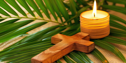Wooden cross, candle and palm leaves