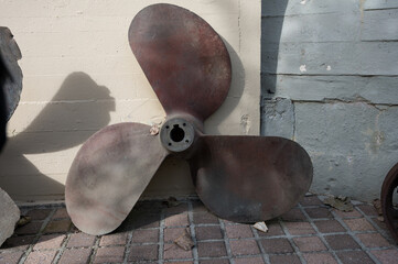 Detail of an old large three-bladed ship propeller from the Second World War