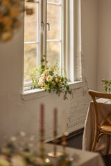 Flowers in a window at a wedding venue.