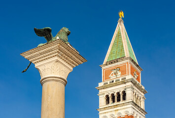 Fototapeta na wymiar St. Mark's column and Campanile tower on San Marco square, Venice, Italy