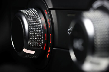 Fototapeta na wymiar temperature control switch inside a car - warm