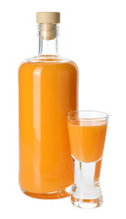 Bottle and shot glass with tasty tangerine liqueur isolated on white
