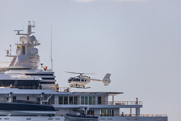 Helicopter landing on Mega Yacht  anchored in Indian Bay, Saint Vincent and the Grenadines