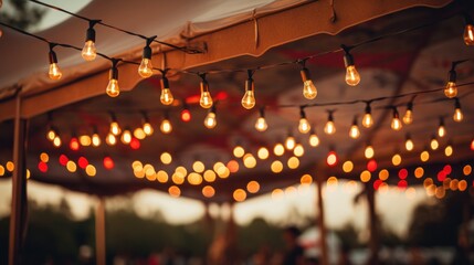 colorful string lights that are hanging at a nighttime event - obrazy, fototapety, plakaty