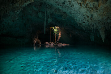 Cave with blue and green water at Sac Actun cenote