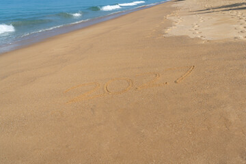 2027 written in the sand on the beach - Happy New Year
