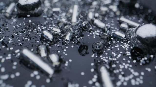 Silver bullet shells in an abstract background.