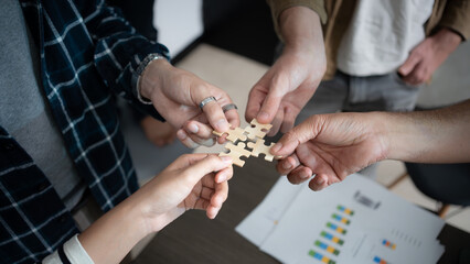 Hand holding jigsaw puzzles, Business partnership concept. Businesswoman hand connecting jigsaw...