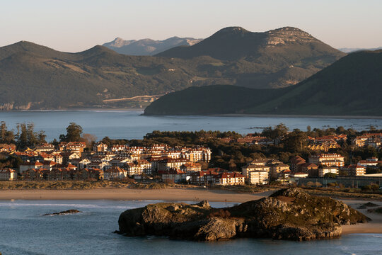Panoramic view of the beautiful village of Noja since an observation point at sunset in a sunny day, Cantabria, Spain.