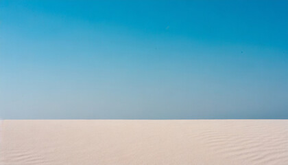 Fototapeta na wymiar Clear blue sky with white sand dune. Desert horizon landscape. Background with space for text