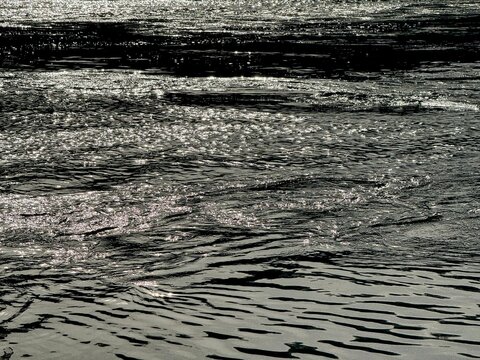 Sparkling river water with ripples.