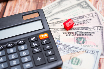 Housing market in the United States. Calculator next to keys and American dollars