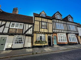 Fototapeta na wymiar Tudor style houses with black and white timber frame on a quaint English street