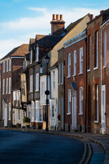 Quiet English street with charming townhouses in variety of architectural styles