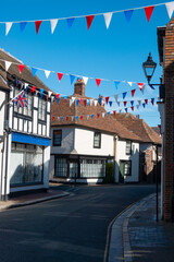 Festive spirit in a decorated street in the middle of a charming English town