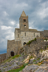 Fototapeta na wymiar Church of Portovenere on the rock with cloudy sky, Liguria, italy