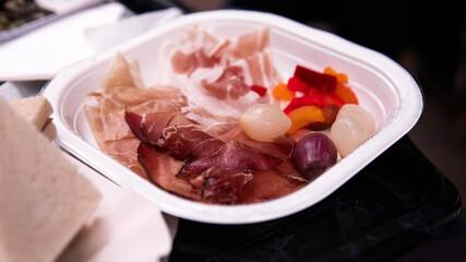 Gourmet Cured Meat and Pickled Vegetables on a Serving Plate
