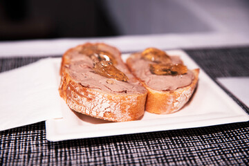 Toasted Bread Topped with Pâté and Golden Jelly on White Plate