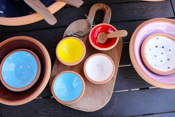 original vintage ceramic dishes on a wooden table at a flea market